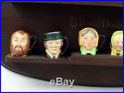 Lot of TWELVE 1½ inch Royal Doulton Charles Dickens Character Mini Jugs & shelf