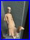 Royal Doulton Figure Women walking her dog. I believe made of Porcelain. Tall