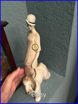 Royal Doulton Figure Women walking her dog. I believe made of Porcelain. Tall